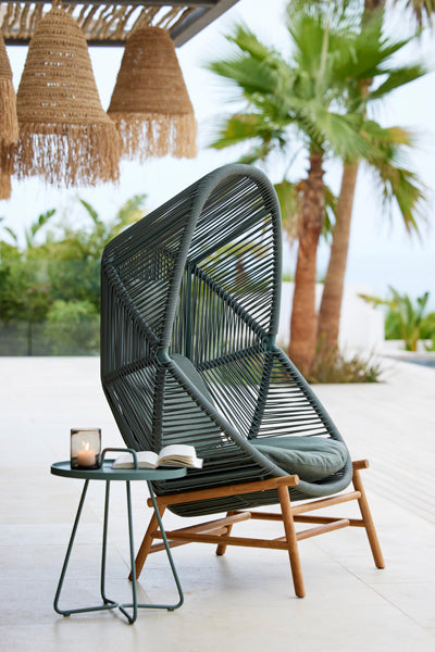 Hive Chair with Base by Cane-Line, showing hive chair with base in live shot.
