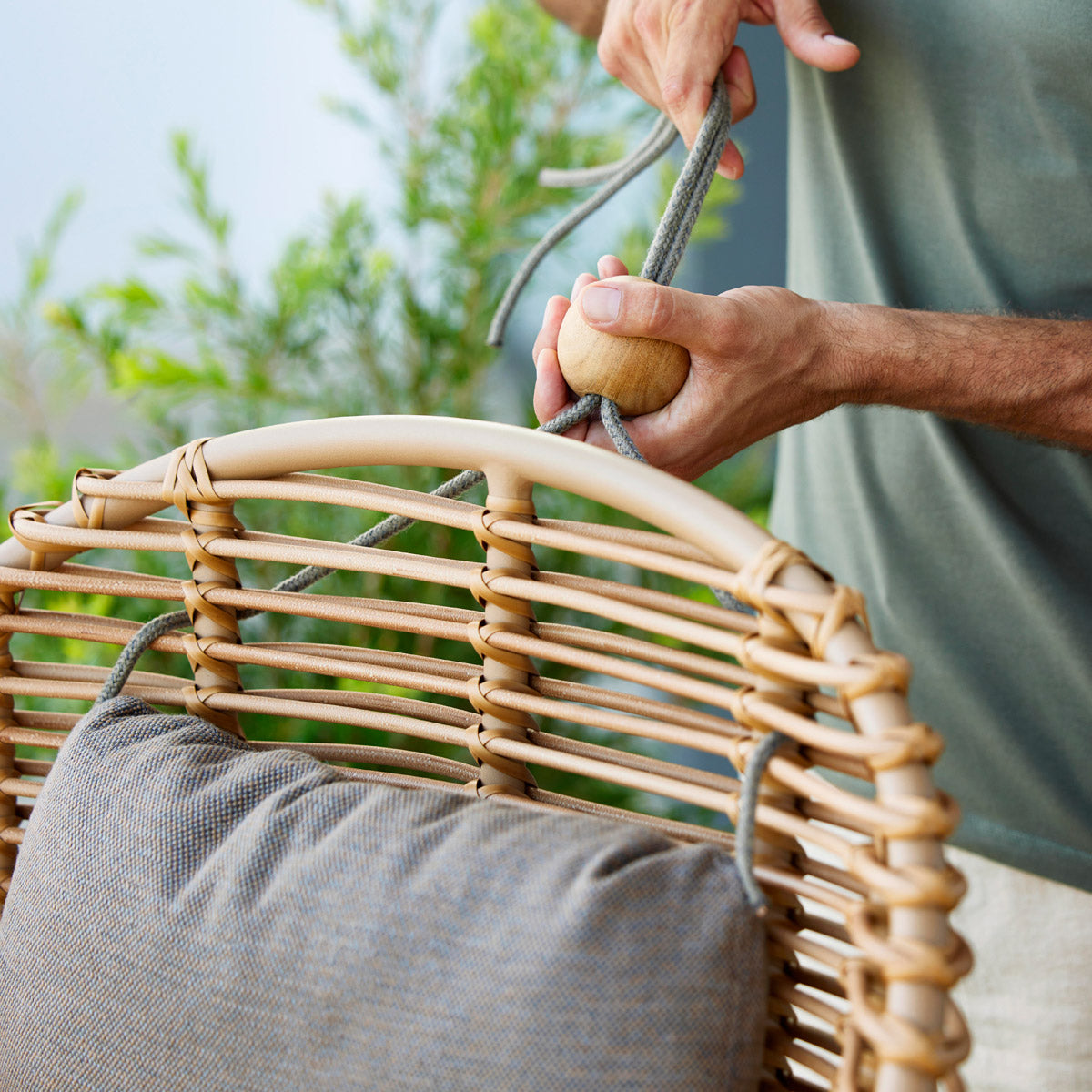 Hive Hanging Chair with Rope by Cane-Line, showing closeup view of hive hanging chair with rope in live shot.