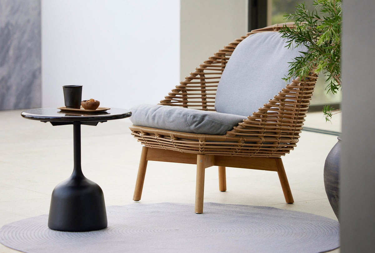 Hive Lounge Chair by Cane-Line, showing hive lounge chair in live shot.