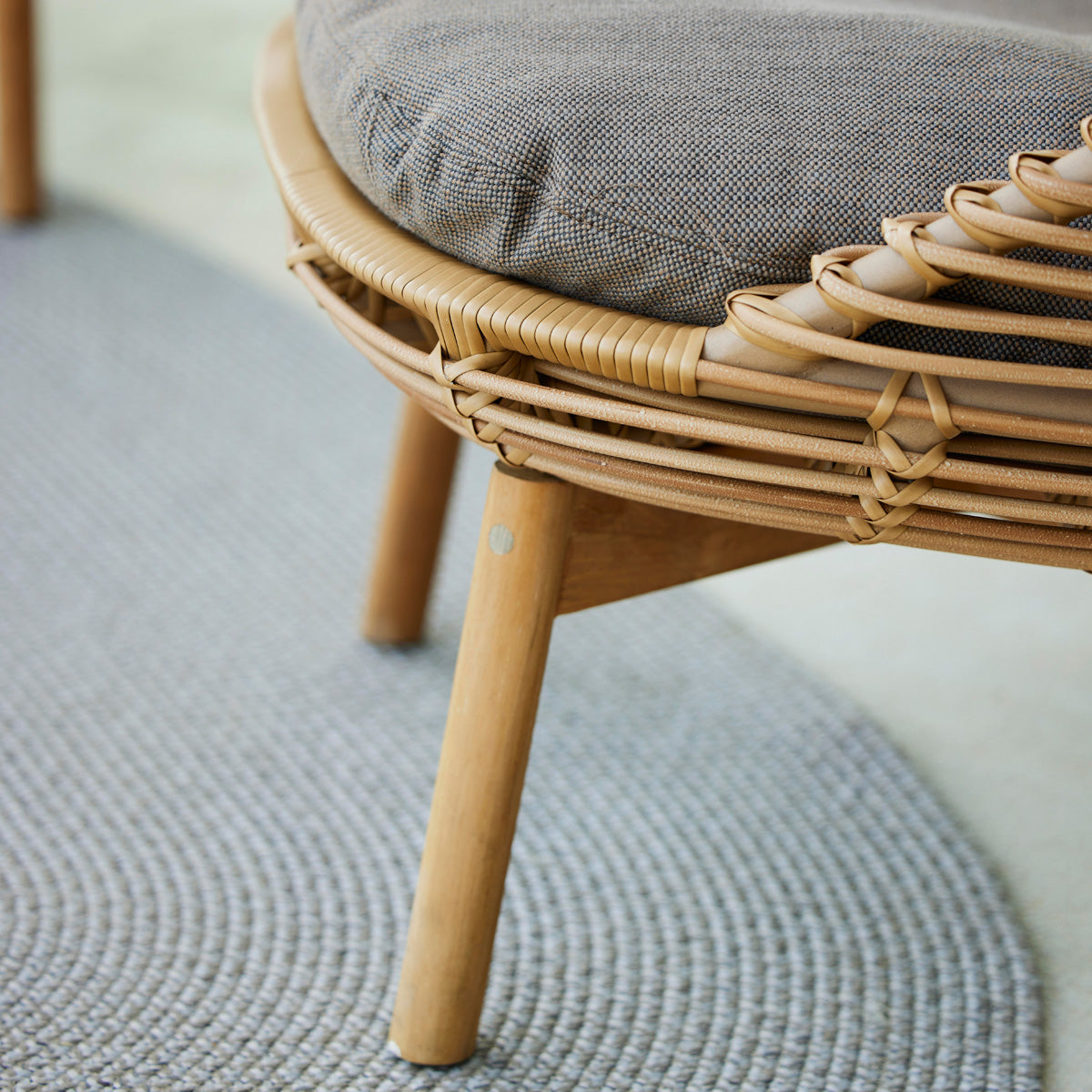 Hive Lounge Chair by Cane-Line, showing closeup view of hive lounge chair in live shot.