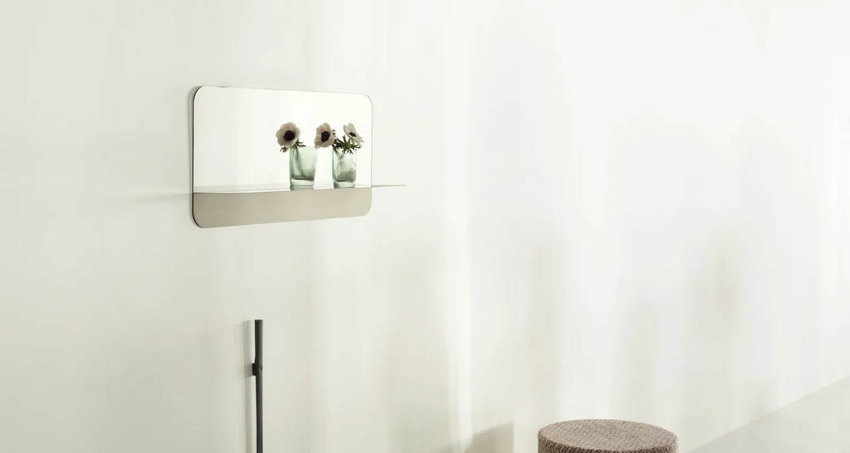 Horizon Mirror by Normann Copenhagen, showing horizon mirror in live shot.