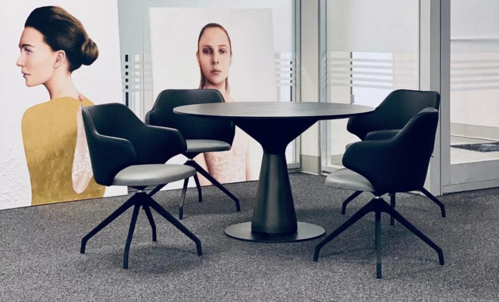 Host Swivel Arm Chair by Kollektiff, showing host swivel arm chairs in live shot.