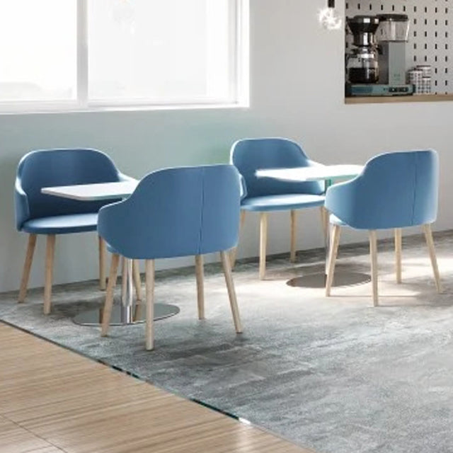 Host Wood Arm Chair by Kollektiff, showing host wood arm chairs in live shot.