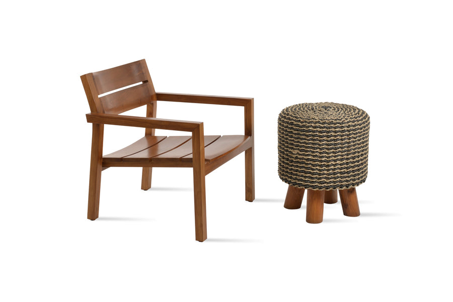Hrant Lounge Armchair by SohoConcept, showing angle view of hrant lounge armchair in teak wood/no seat cushion with table.