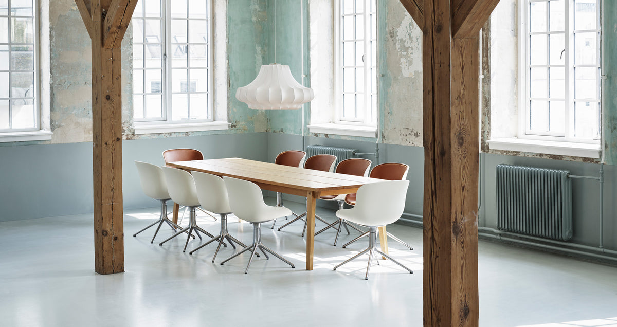 Hyg Front Upholstery 4L Swivel Chair by Normann Copenhagen, showing hyg front upholstery 4l swivel chairs in live shot.