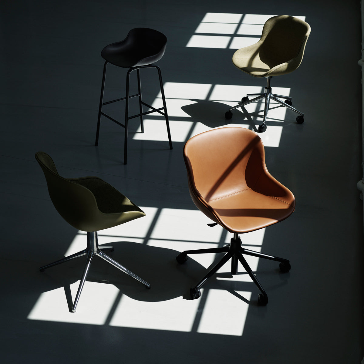 Hyg Front Upholstery 4L Swivel Chair by Normann Copenhagen, showing hyg front upholstery 4l swivel chair in live shot.