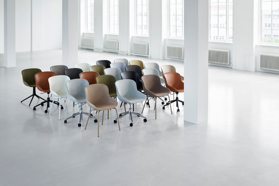 Hyg Front Upholstery 4L Swivel Chair by Normann Copenhagen, showing hyg front upholstery 4l swivel chairs in live shot.
