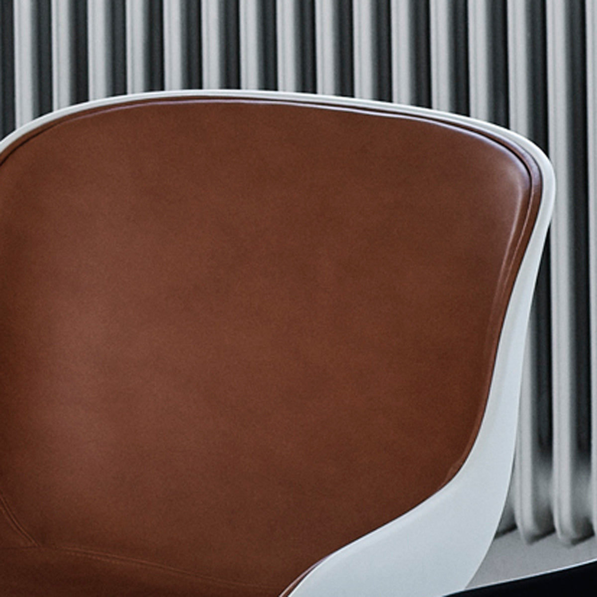 Hyg Front Upholstery Chair Wood Legs by Normann Copenhagen, showing closeup view of hyg front upholstery chair wood legs in live shot.