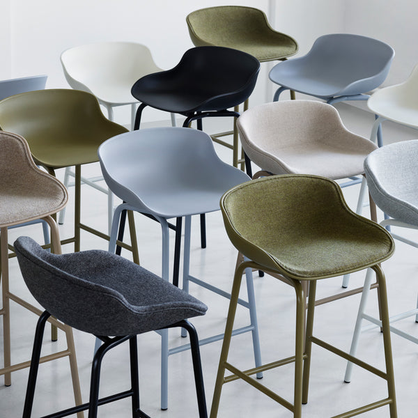 Hyg Front Upholstery Steel Barstool by Normann Copenhagen, showing closeup view of hyg front upholstery steel barstools in live shot.