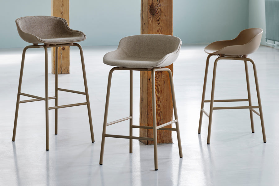 Hyg Front Upholstery Steel Barstool by Normann Copenhagen, showing hyg front upholstery steel barstool in live shot.