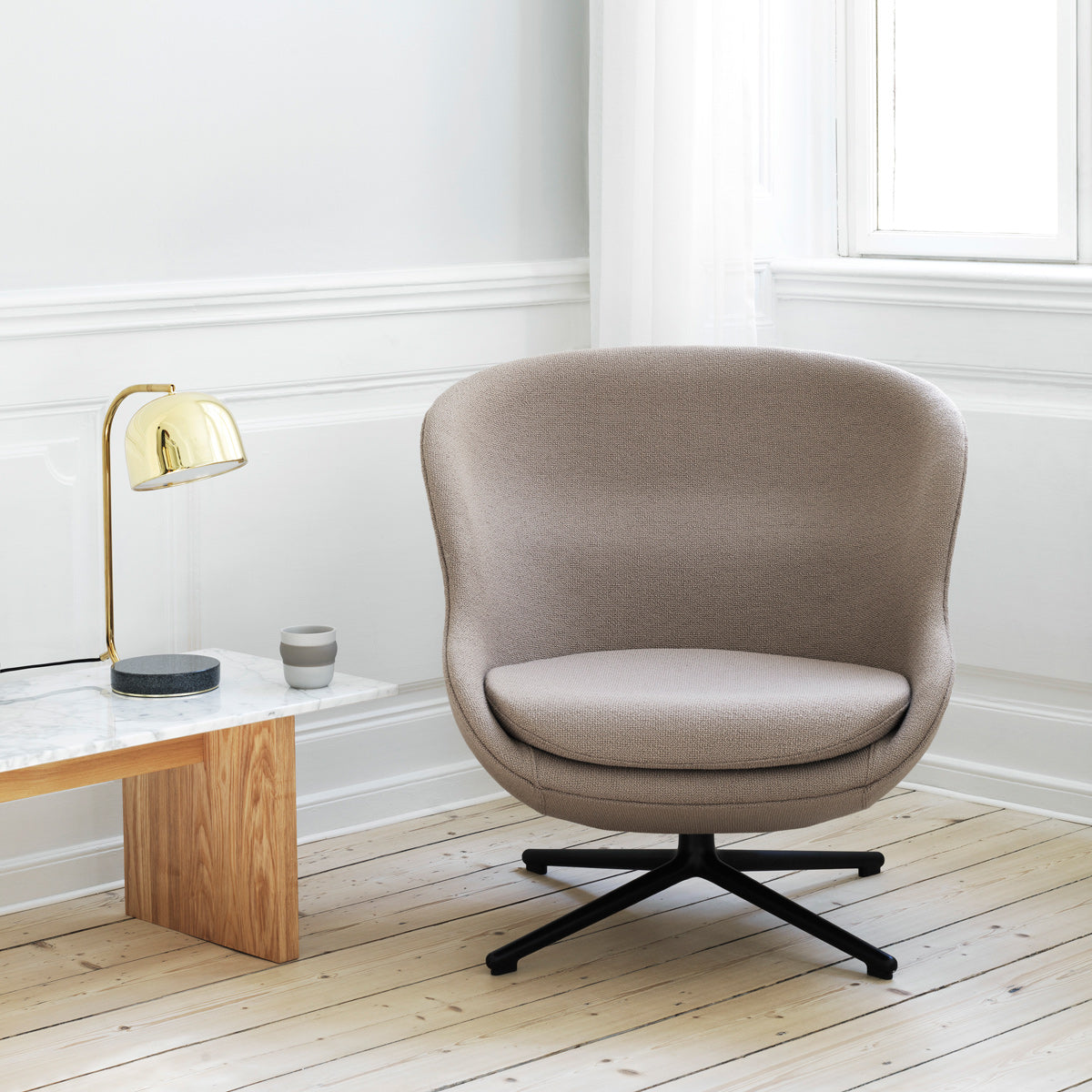 Hyg Lounge Swivel Chair by Normann Copenhagen, showing hyg lounge swivel chair in live shot.
