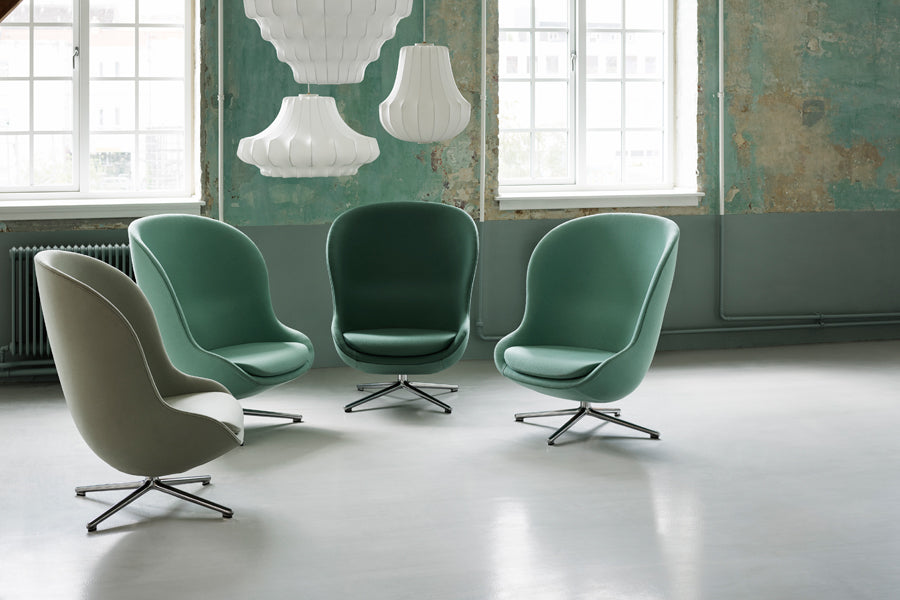 Hyg Lounge Swivel Chair by Normann Copenhagen, showing hyg lounge swivel chairs in live shot.