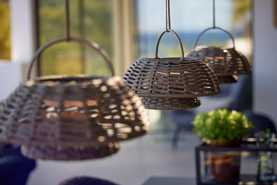 Illusion Hanging Lamp by Cane-Line, showing illusion hanging lamps in live shot.