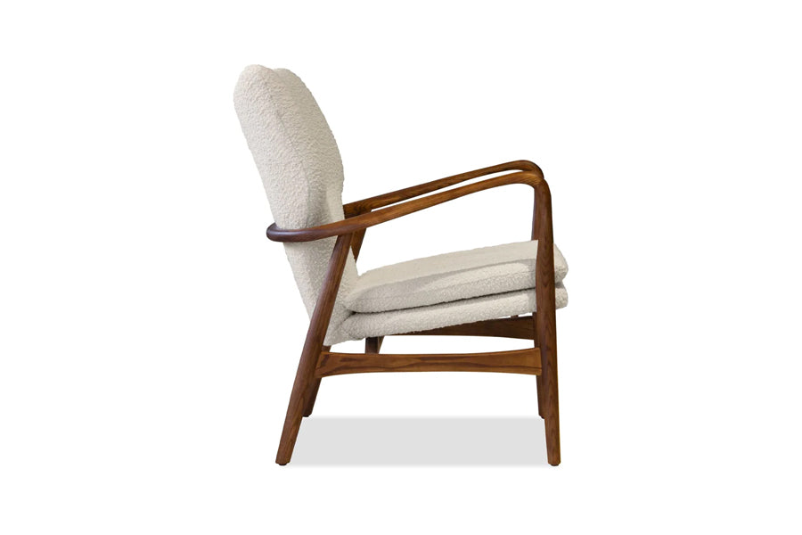 Ingrid Occasional Chair by Mobital, showing side view of ingrid occasional chair in cream boucle fabric/walnut ash frame.