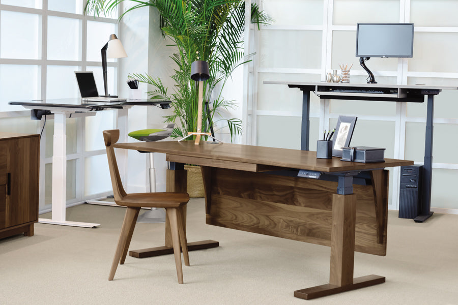 Invigo 30" x 72" Sit-Stand Rounded Rectangle Desk with Cutout & Wire Pass Grommet (Left) by Copeland Furniture, showing invigo 30" x 72" sit-stand rounded rectangle desk with cutout & wire pass grommet (left) in live shot.