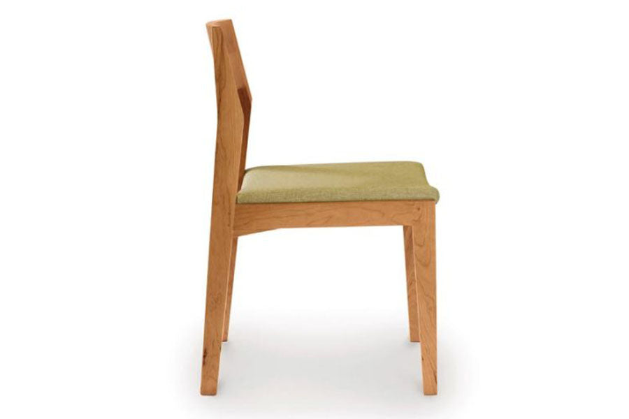 Iso Side Chair In Cherry by Copeland Furniture, showing side view of iso side chair In cherry.