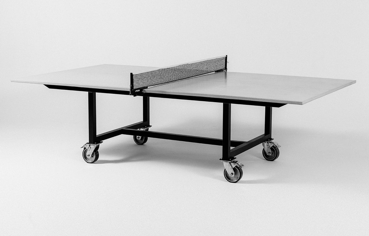 James De Wulf Rolling Ping Pong Table by James De Wulf - White Concrete, Black Powder Coated Steel.