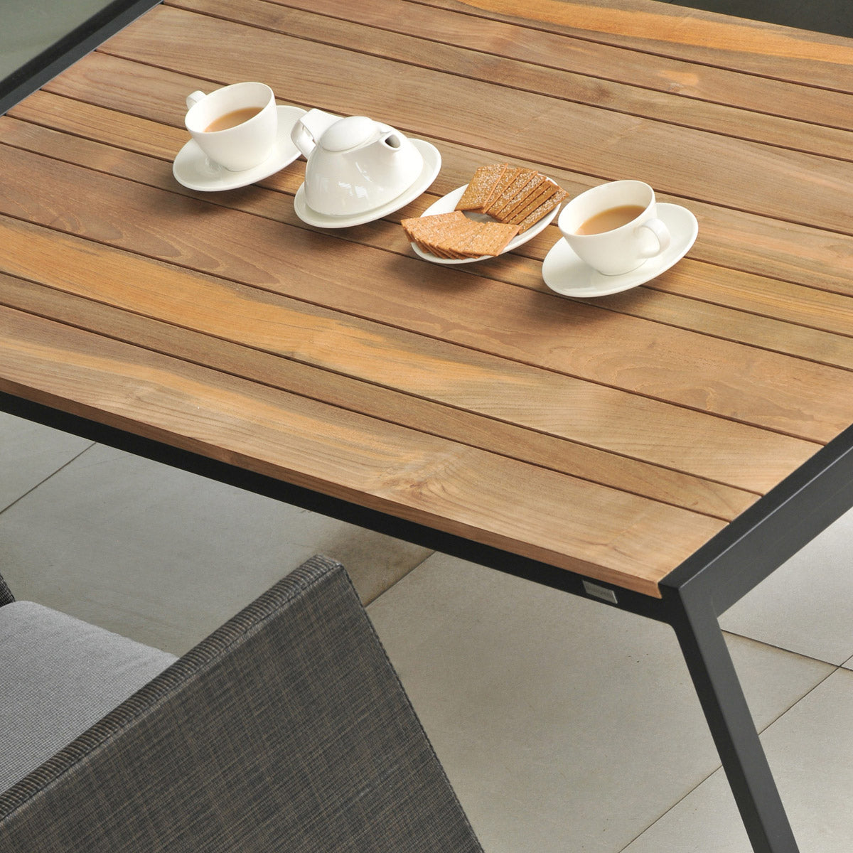 Jaydu Teak Coffee Table by Mamagreen, showing closeup view of jaydu teak coffee table in live shot.