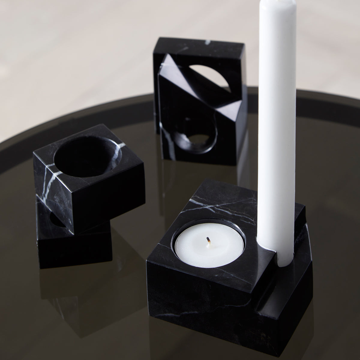 Jeu De Dés Candle Holder by Woud, showing jeu de dés candle holders in live shot.