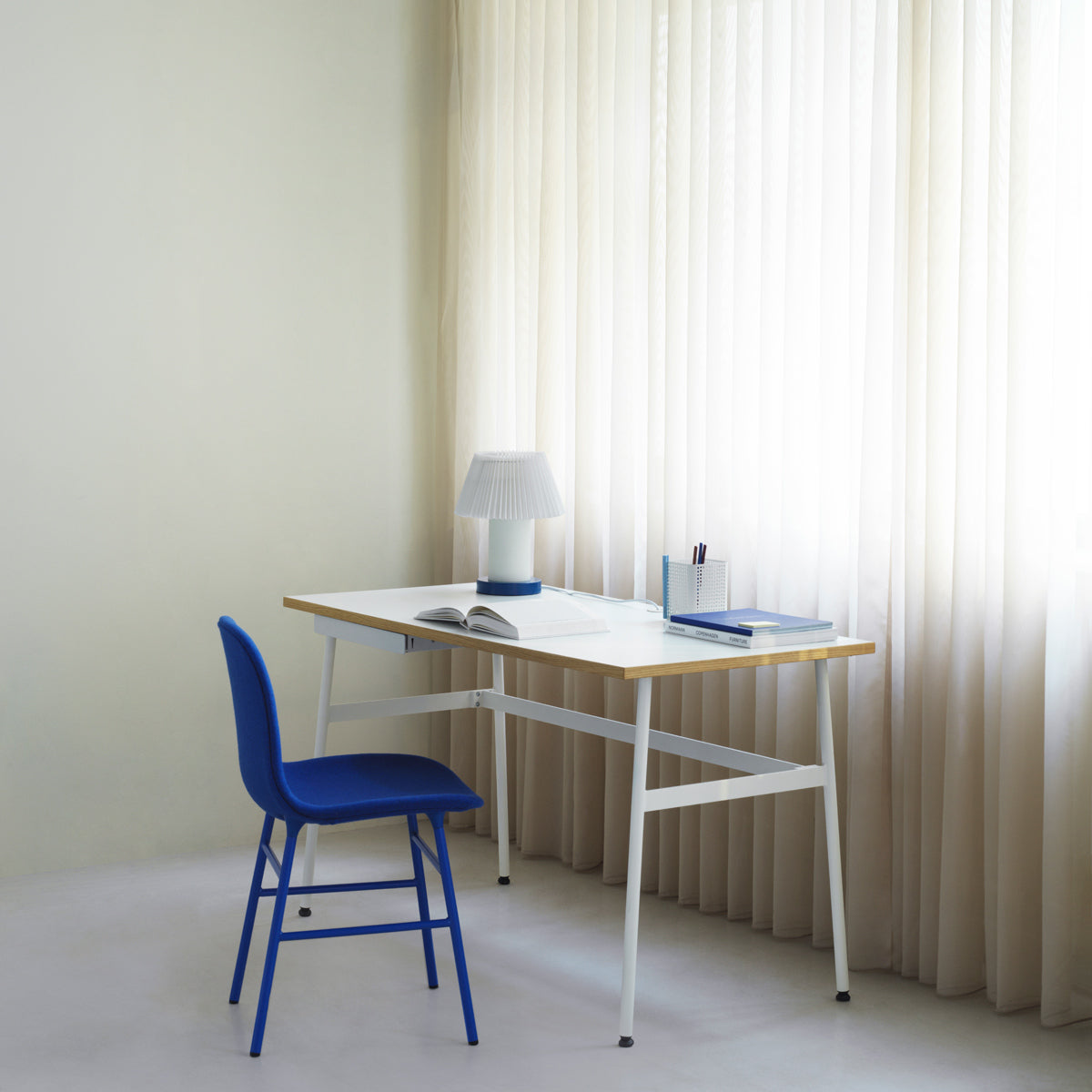 Journal Desk by Normann Copenhagen, showing journal desk with chair in live shot.