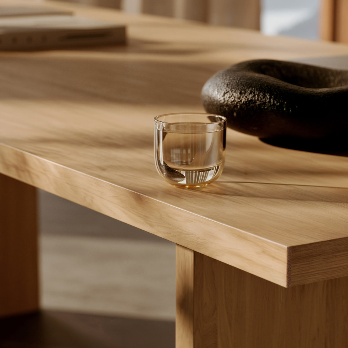 Kimono Dining Table by Woud, showing closeup view of kimono dining table in live shot.