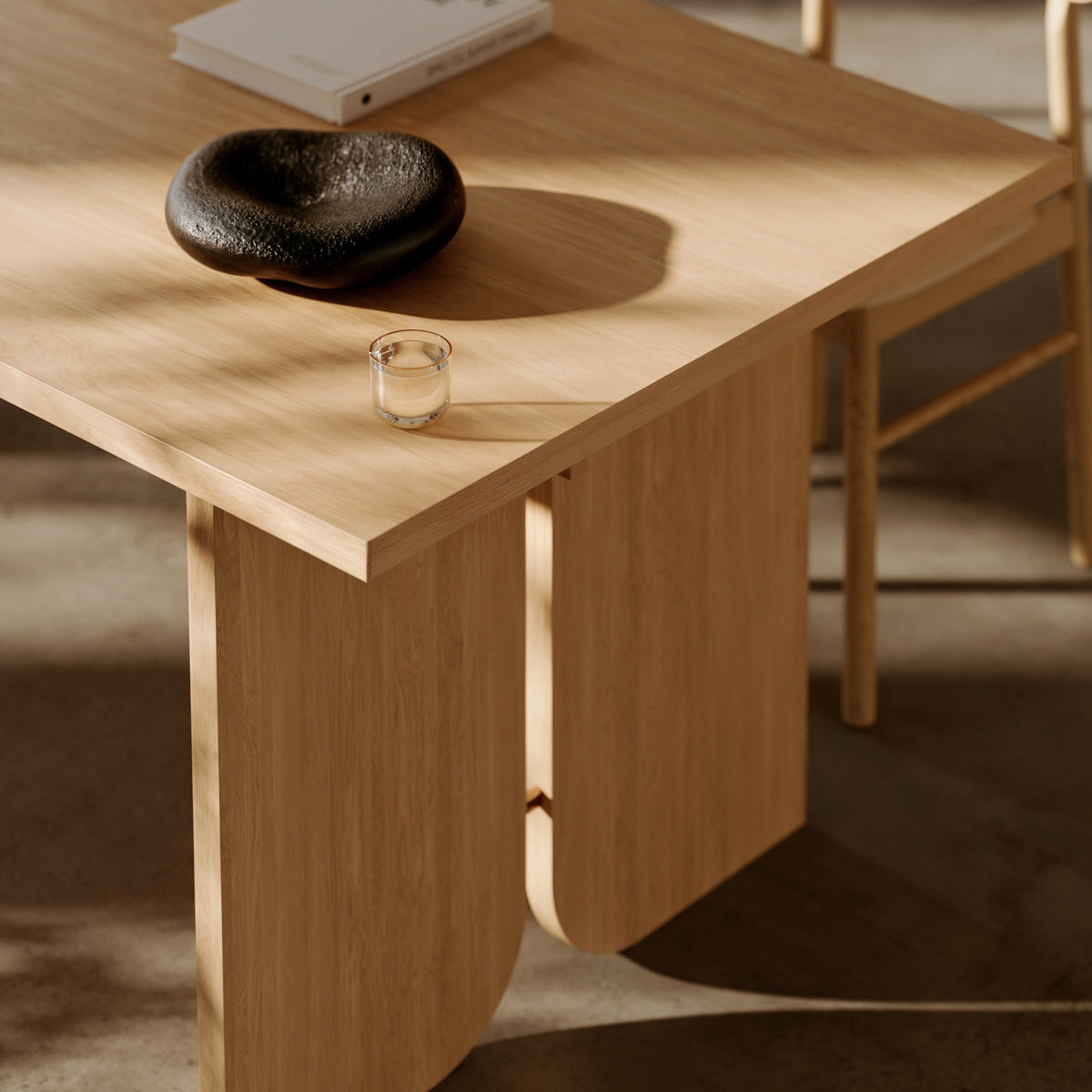 Kimono Dining Table by Woud, showing closeup view of kimono dining table in live shot.