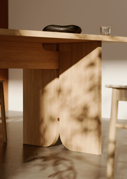 Kimono Dining Table by Woud, showing closeup view of kimono dining table in live shot.