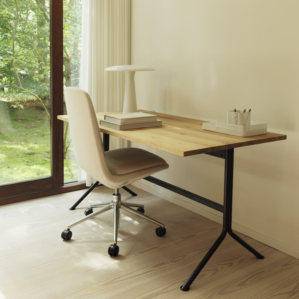 Kip Desk by Normann Copenhagen, showing kip desk with chair in live shot.