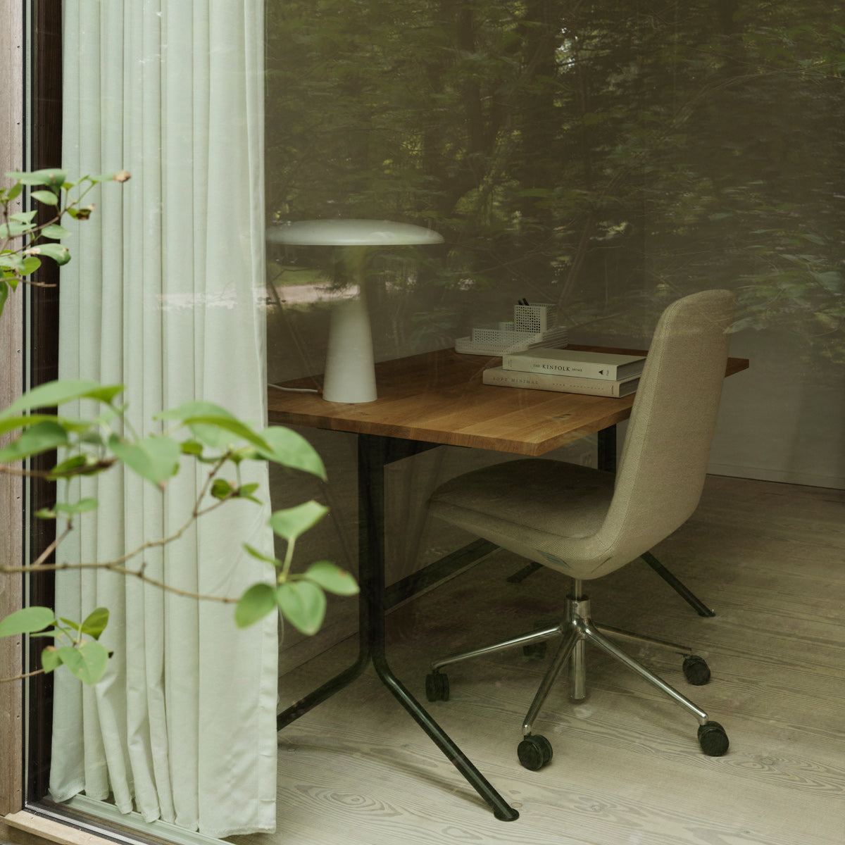 Kip Desk by Normann Copenhagen, showing kip desk with chair in live shot.