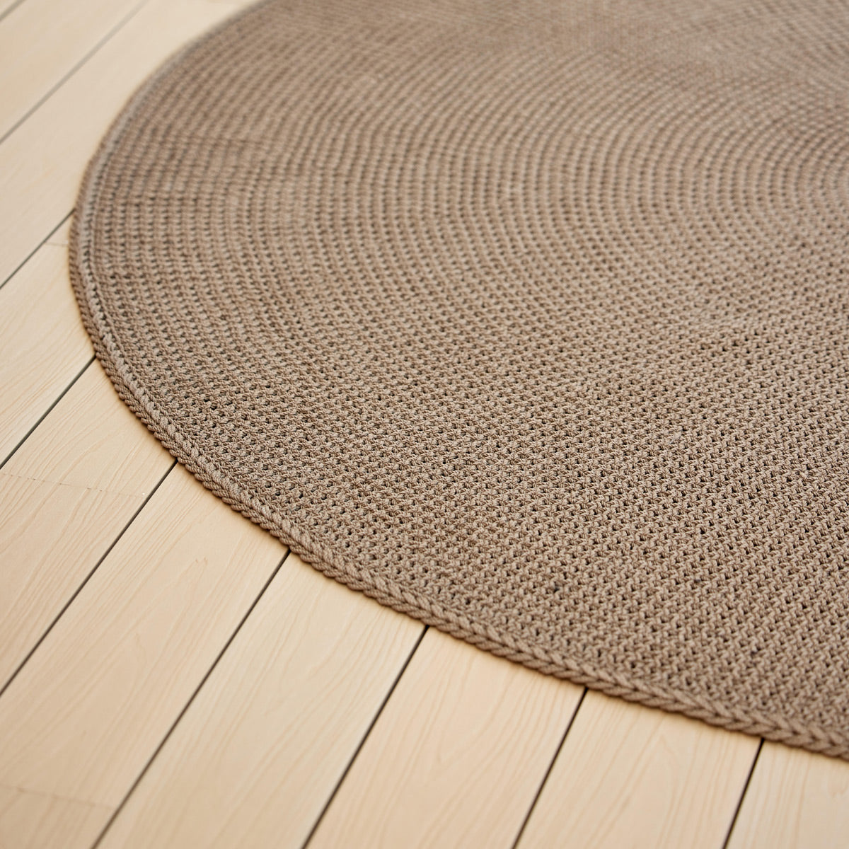 Knit Rug by Cane-Line, showing closeup view of knit rug in live shot.