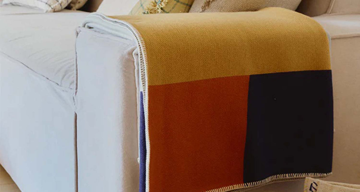 Knitted Color Composition Blanket by Lorena Canals, showing knitted color composition blanket in live shot.