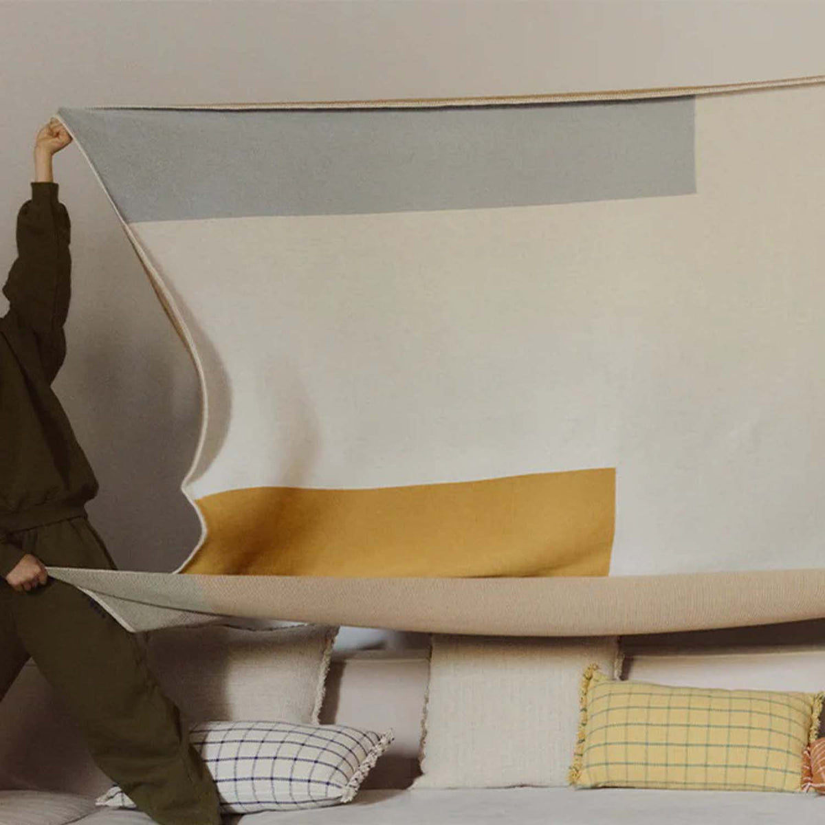 Knitted Color Composition Blanket by Lorena Canals, showing knitted color composition blanket in live shot.