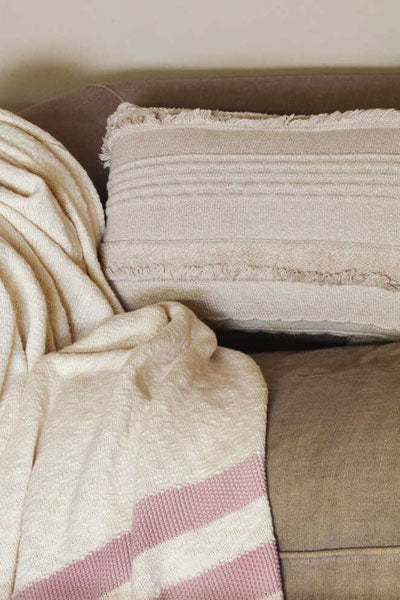 Knitted Cushion Air Dune White by Lorena Canals, showing knitted cushion air dune white in live shot.