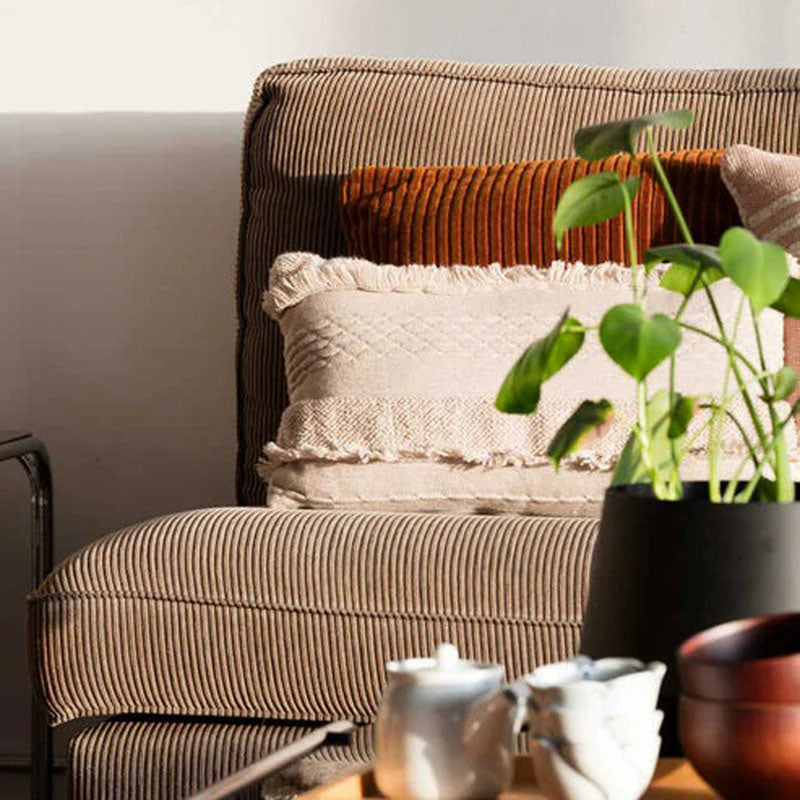 Knitted Cushion Air Dune White by Lorena Canals, showing knitted cushion air dune white in live shot.