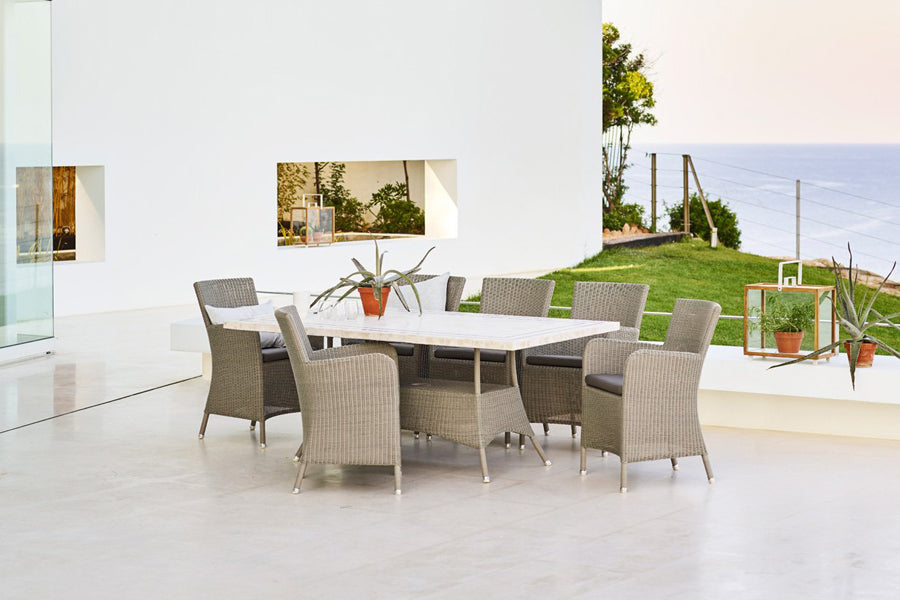 Lansing Table by Cane-Line, showing lansing table in live shot.