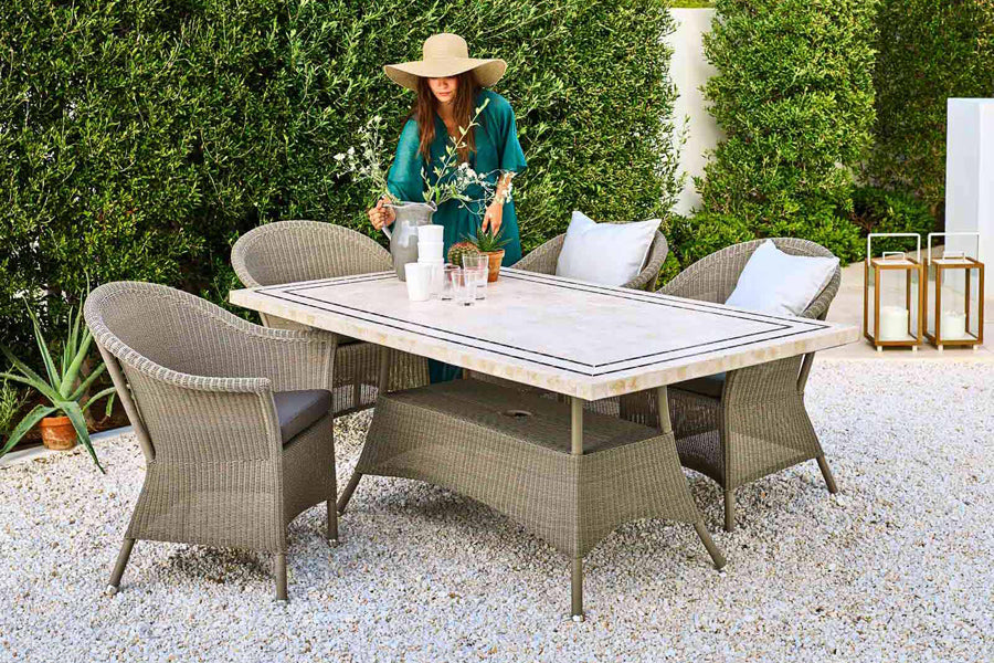 Lansing Table by Cane-Line, showing lansing table in live shot.