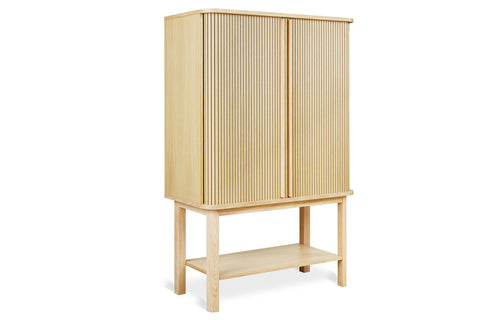 Ledger Tall Cabinet by Gus, showing angle view of ledger tall cabinet.