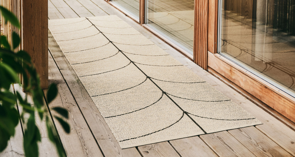 Leif Dark Brown Runner Rug by Pappelina, showing leif dark brown runner rug in live shot.