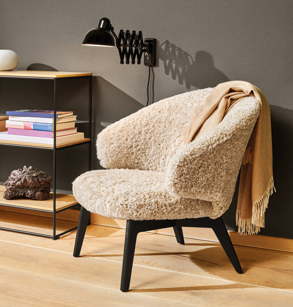 Let Lounge Chair by Fritz Hansen, showing let lounge chair in live shot.