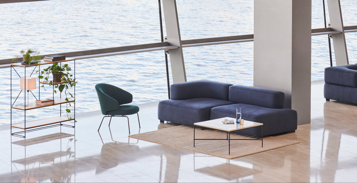 Let Lounge Chair by Fritz Hansen, showing let lounge chair in live shot.