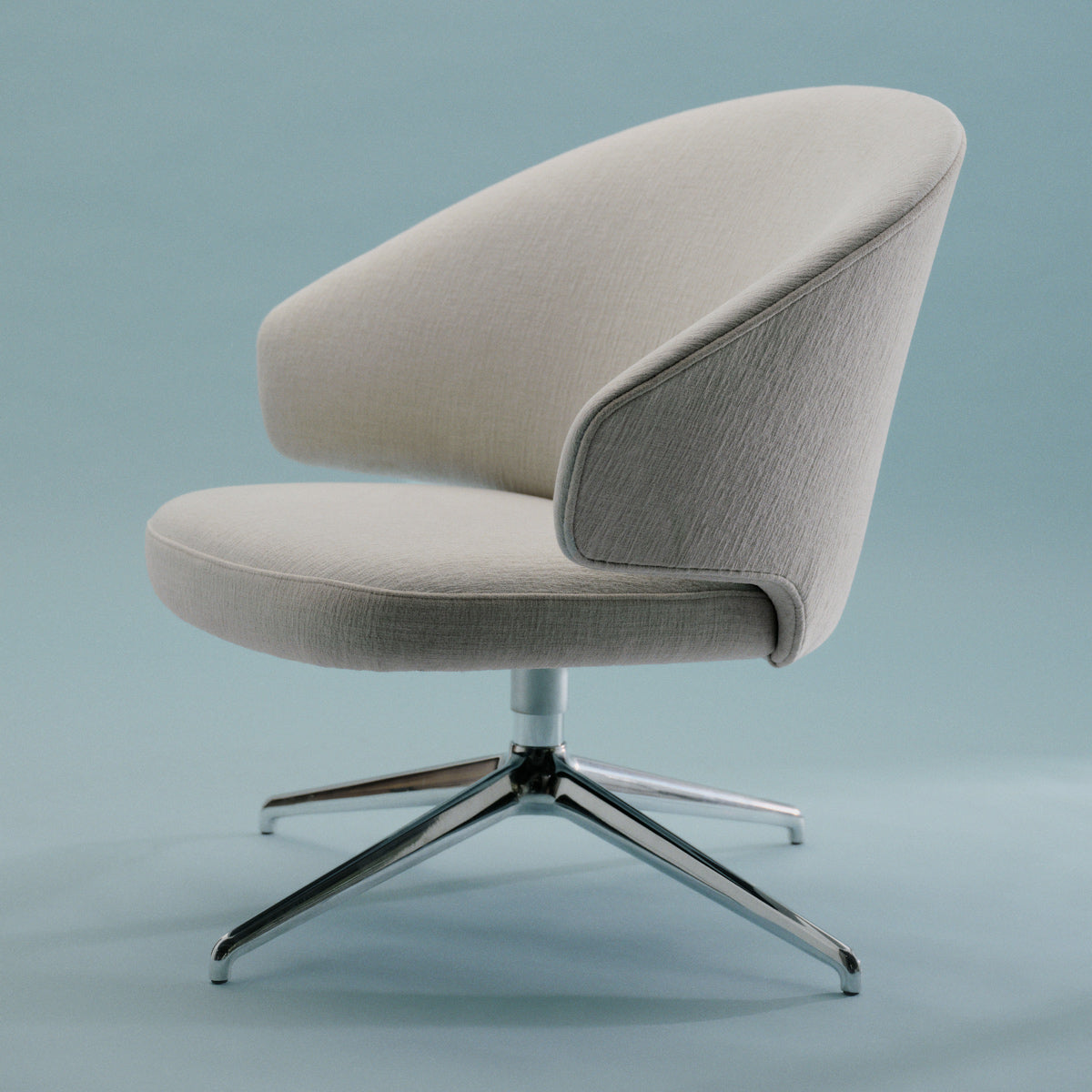 Let Lounge Chair by Fritz Hansen, showing let lounge chair in live shot.