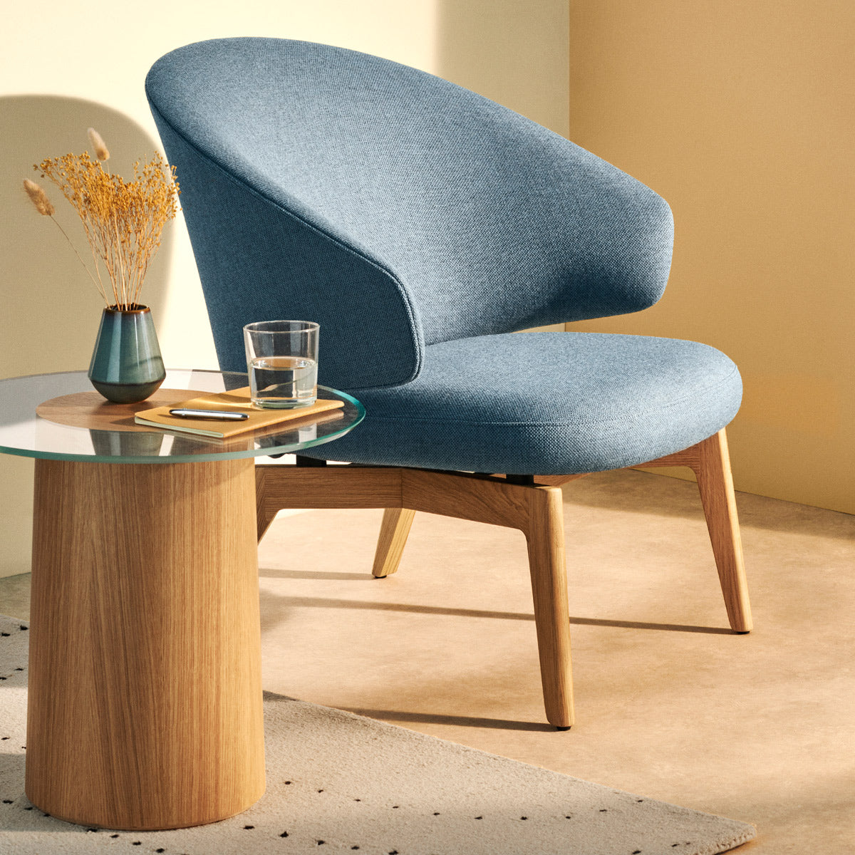Let Lounge Chair by Fritz Hansen, showing let lounge chair in live shot.