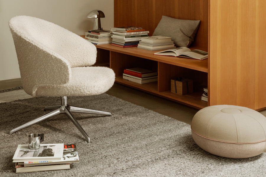 Let Lounge Chair by Fritz Hansen, showing let lounge chair in live shot.