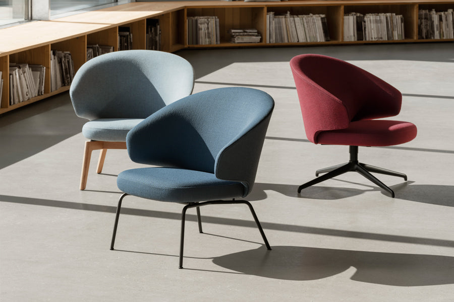 Let Lounge Chair by Fritz Hansen, showing let lounge chairs in live shot.