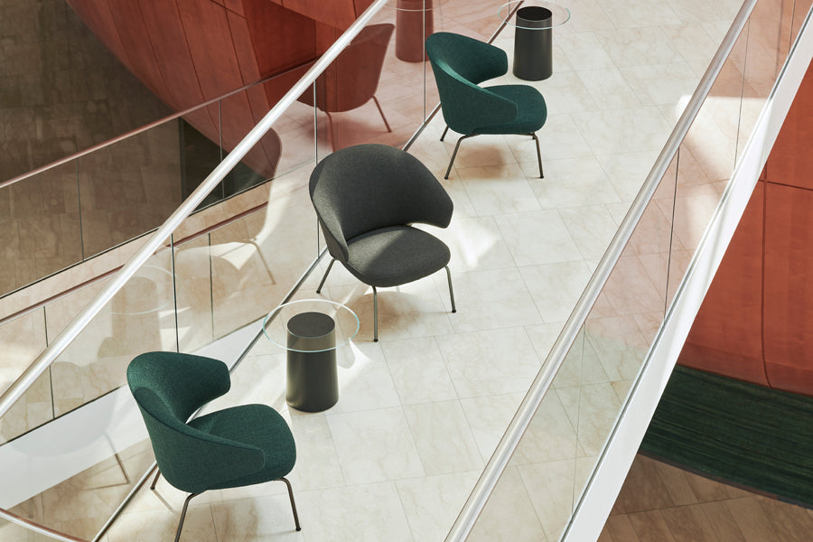 Let Lounge Chair by Fritz Hansen, showing let lounge chairs in live shot.
