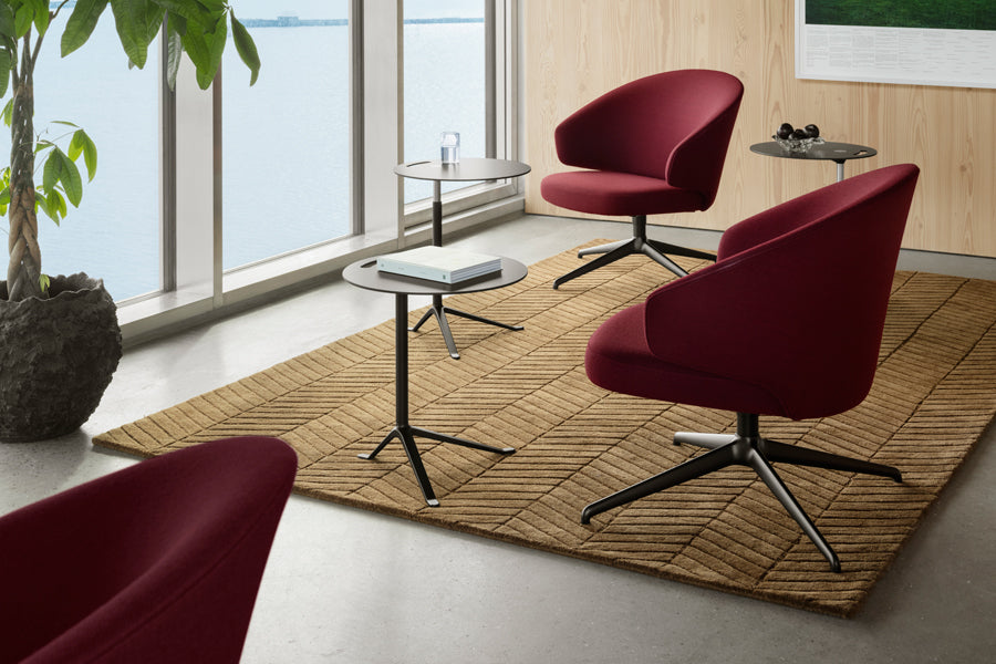 Let Lounge Chair by Fritz Hansen, showing let lounge chairs in live shot.