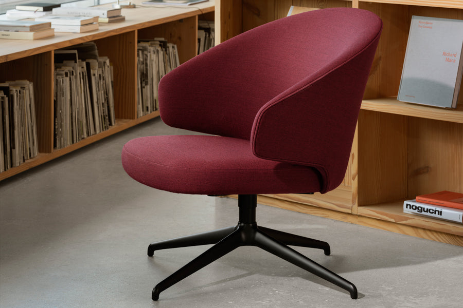 Let Lounge Chair by Fritz Hansen, showing let lounge chair in live shot.