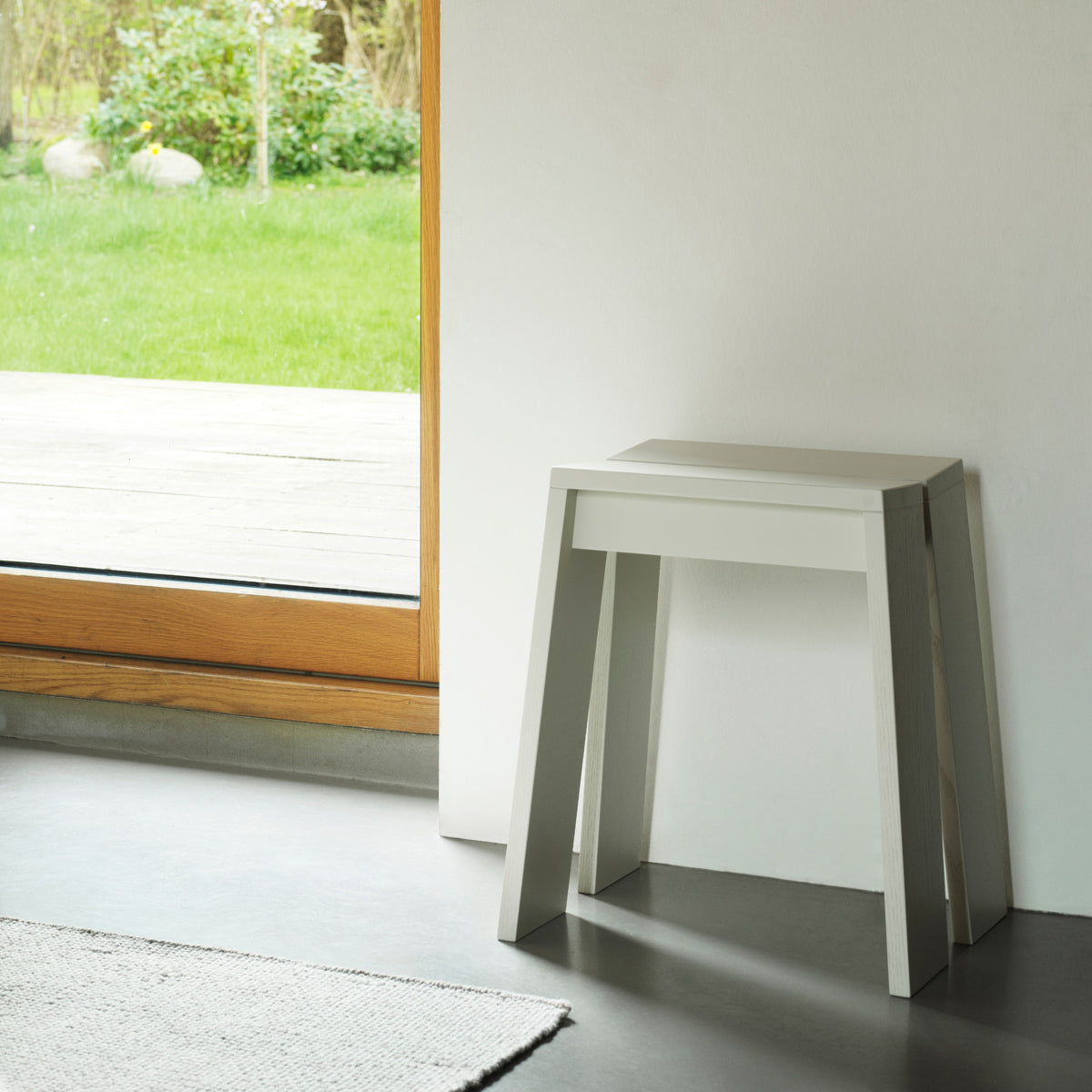 Let Stool by Normann Copenhagen, showing let stool in live shot.