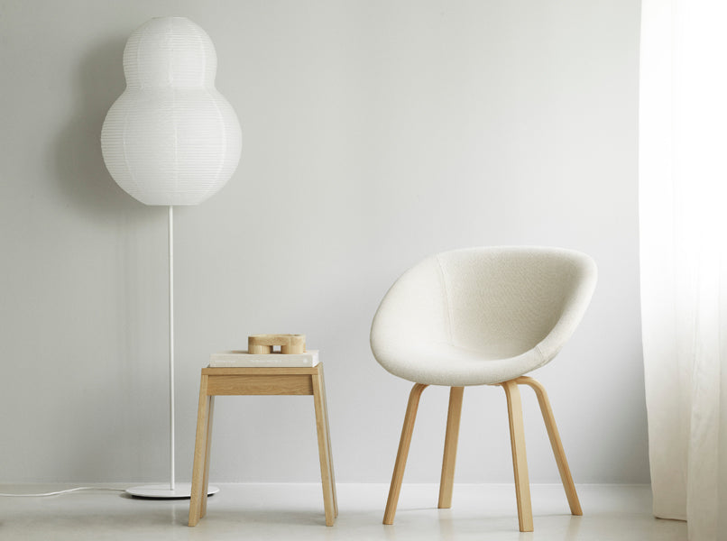 Let Stool by Normann Copenhagen, showing let stool with chair in live shot.
