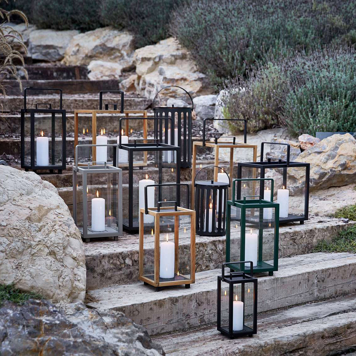 Lighthouse Small Lantern by Cane-Line, showing lighthouse small lanterns in live shot.
